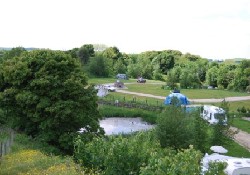 Environmental pond and tent pitches. Environmental pond and tent pitches.