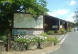 Cenarth Falls Holiday Park entrance with its pinelog Reception Building