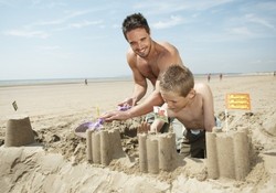 Build sandcastles on the 6-mile beach near Camber Sands